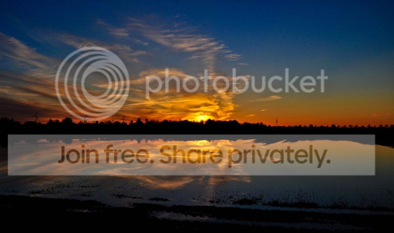 sunset_reflection_in_the_field_by_b.jpg